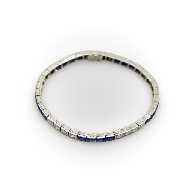 This is a classic Art Deco line bracelet, featuring 20 Old European Cut diamonds and 20 calibre cut sapphires set in...