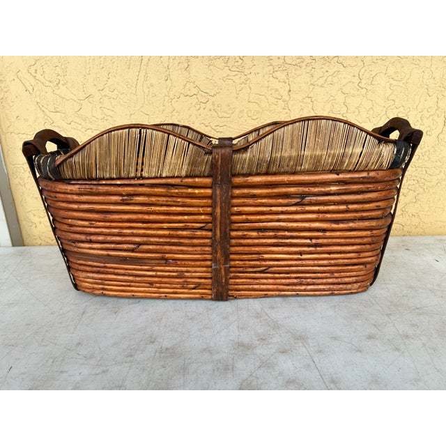 Vintage oval wooden basket. Made from woven willow or bamboo with a dark stain and a contrasting lighter, tightly-woven...