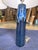 This stylish table lamp blends boho charm with contemporary design, featuring a sleek blue ceramic base in a deep cobalt...
