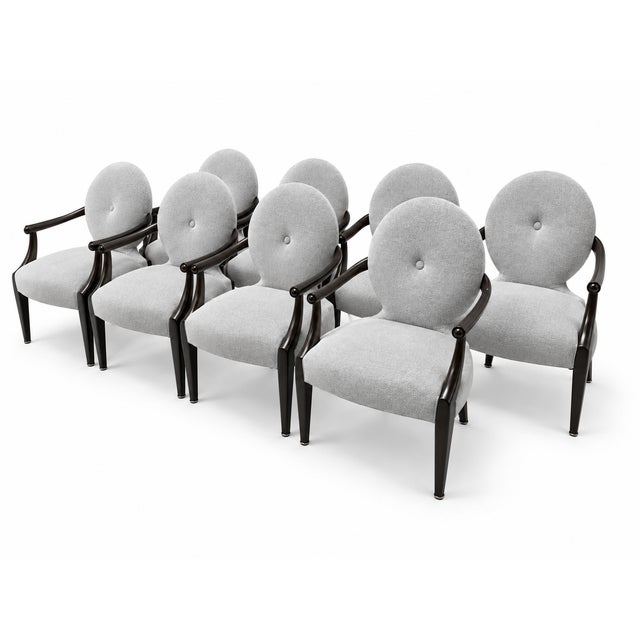 A Classic set of eight John Hutton "Casper" dining chairs for Donghia. The chairs are finished in an ebony stain and...