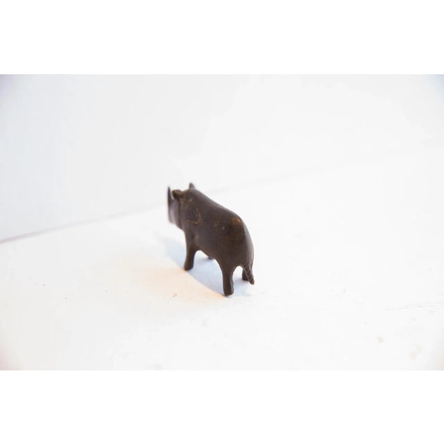 :: Vintage handmade African dark patina rhino figurine. Circa mid 20th century, though possibly older, this piece has such...