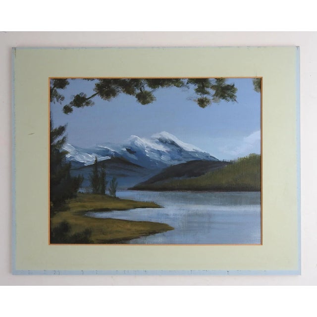 Oil on artist board painting of mountain lake. Unsigned. Displayed firmly attached to mat and backing, fading to mat.