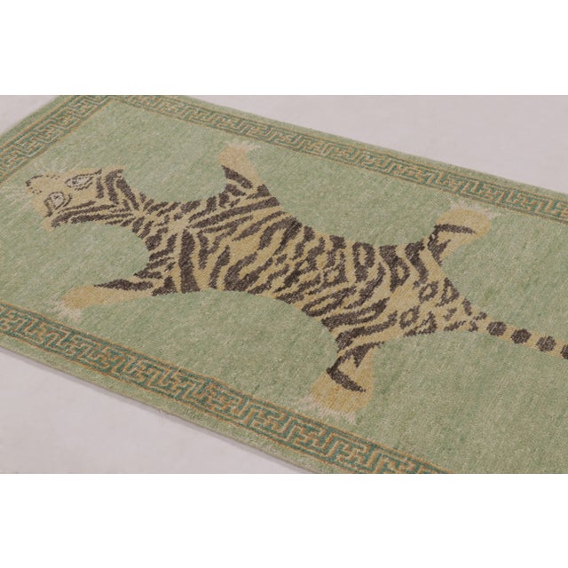 Hand-knotted in premium wool, this 3x6 runner rug is a striking new Distressed Homage addition to our collection, inspired...