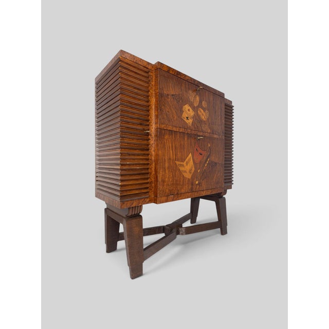 A refined Italian bar cabinet designed by Pier Luigi Colli, distinguished by its highly architectural construction and...