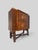 A refined Italian bar cabinet designed by Pier Luigi Colli, distinguished by its highly architectural construction and...
