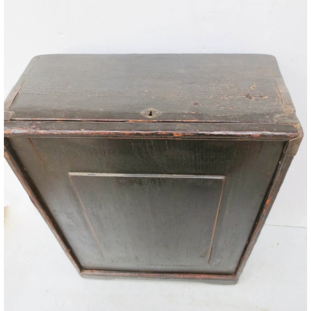 Antique Chinese table chest. Elmwood chest with a sliding front panel. The interior drawer is set in various sizes as...