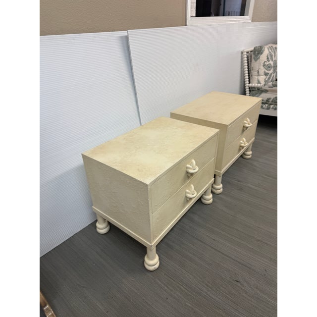 Design Plus Gallery presents a Pair of Post-Modern Off-White Nightstands. Each nightstand has a rectangular case with two...