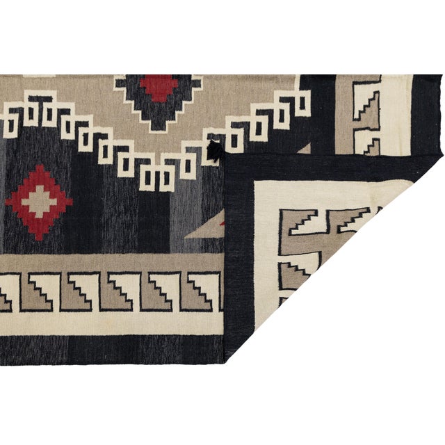 Elevate your space with this striking Modern Navajo style hand-woven wool rug, designed for high-end residential...