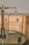 A French brass and steel scale from the 19th century with central column and two weighing pans. Embrace the charm and...