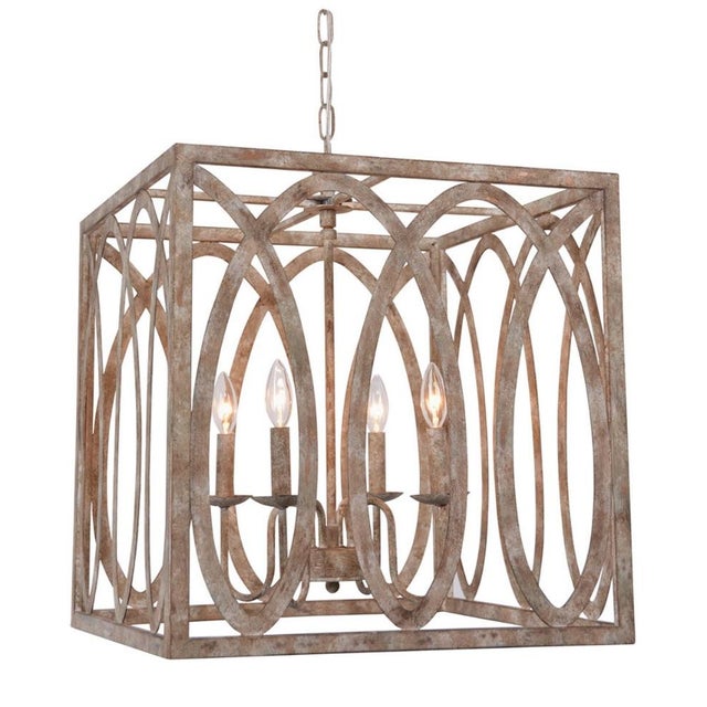 Bring sculptural elegance to your space with this large open-frame lantern chandelier by Terracotta Designs, known for...