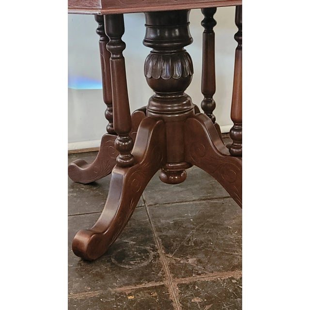 A nice Victorian style marble top dining table. Whit Carrara Marble with Brown carved Mahogany base. Nice substantial...