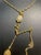 1950s MCM Jewelry Victorian Revival Adjustable Lariat Necklace Features a Gold-Tone Twisted Double Rope Chain With Floral-Embossed Sliding Tension Clip. For Sale - Image 5 of 7
