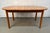 Beautifully crafted Mid-Century Modern teak oval extension dining table, a timeless piece that combines sophisticated...