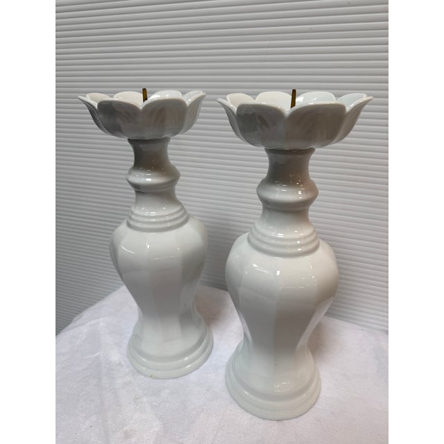 Design Plus Gallery presents a Pair of Ceramic Candleholders with Lotus Shape in White. The duo are tall and gleaming...