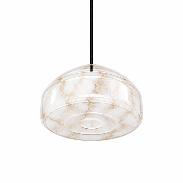 Crafted with high visual clarity, this modern pendant lamp features a sleek silhouette hand-blown from premium glass in a...