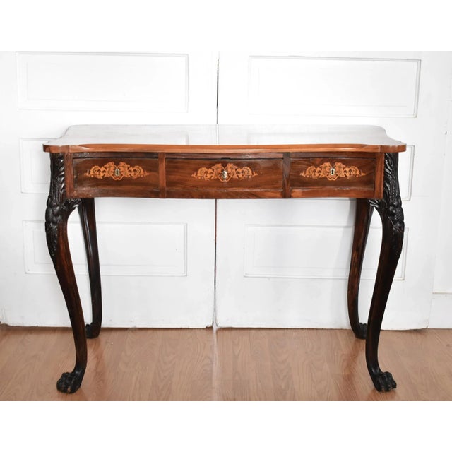 An 18th-century, c. 1730-1750 Irish bureau plat writing desk, featuring dramatic contrast between the main body of...