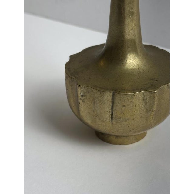 An elegant Art Nouveau brass solifleur vase, produced in Central Europe circa 1910, perfectly expressing the stylised...