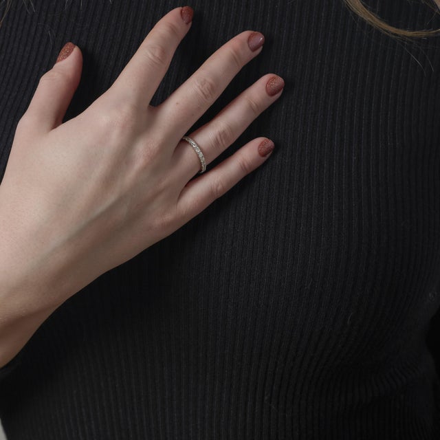 This vintage 14k white gold ring from the 1990’s is set with 22 round brilliant cut diamonds weighing approximately .90...