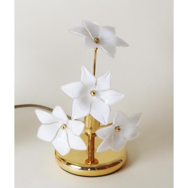 This lovely set of two delicate table lamps was made in Italy. The white glass blossoms are artfully designed and...
