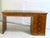 Small Art Deco cubist desk made of light walnut veneer on two sides. It features 2 wide, deep drawers under the tabletop...