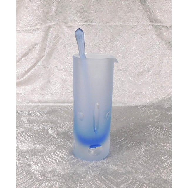 This is a blue cut to clear bar ware set with a pitcher and stir stick plus five matching glasses. Two Glasses have...
