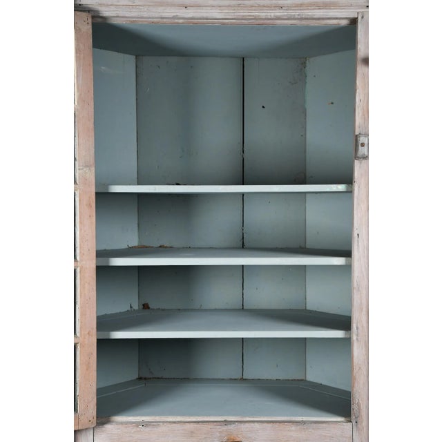 A monumental mid-18th century corner cabinet of architectural scale and sophistication, likely New England in origin, with...