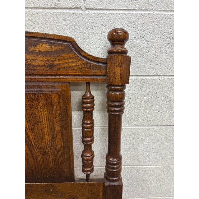 This is an impressive vintage king-size oak headboard featuring a richly distressed warm brown finish and substantial Old...