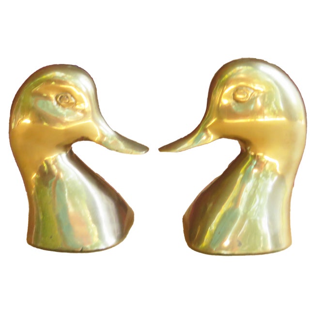 Style your bookshelf with these fun, retro duck bookends to add a bit of brightness and whimsey. Fabricated of heavy brass...