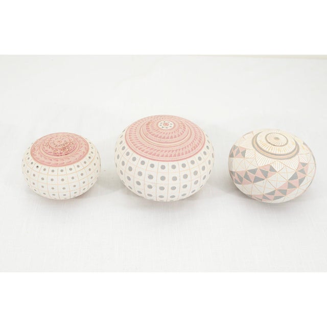 A striking set of three signed Postmodern studio art pottery lidded vessels from 1985, attributed to Madeleine “Landing...