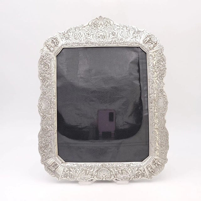 A Dutch silver plate picture frame, circa 1930. The strap that holds the back together is broken.