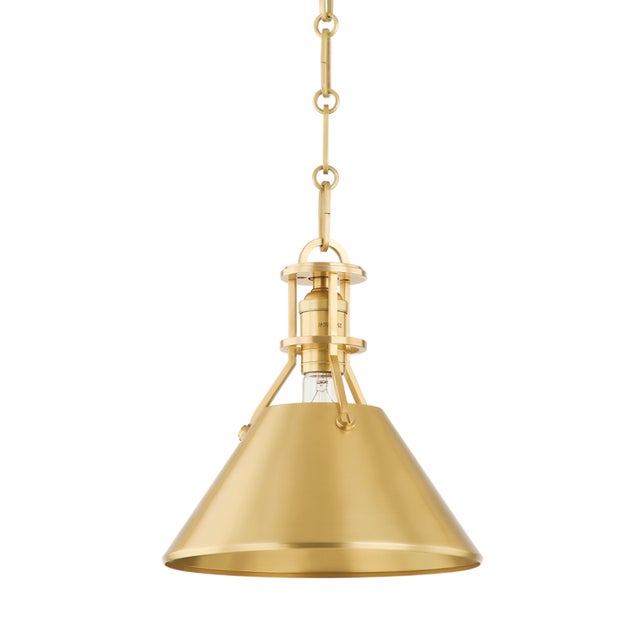 Exposed hardware adds a touch of industrial chic to a timeless cone shade silhouette. Go for a crisp monochromatic look...