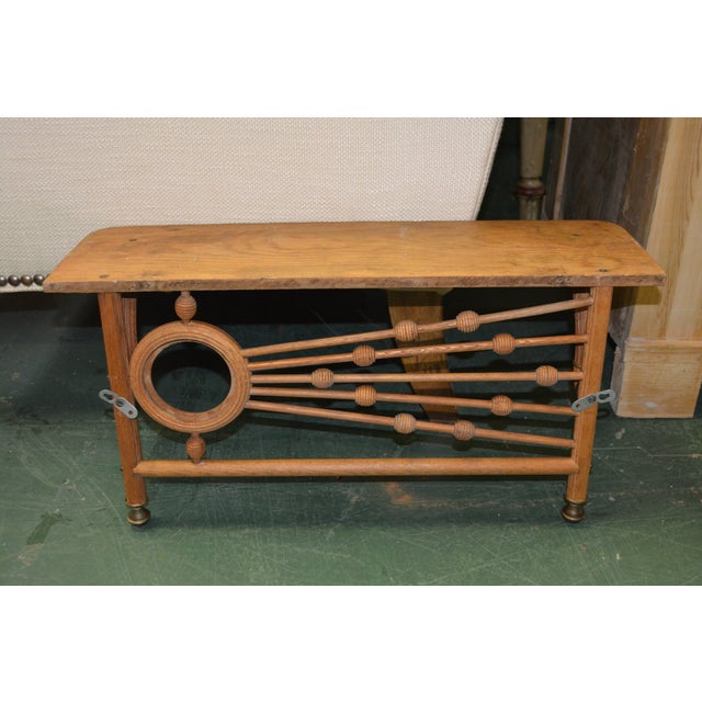 This is a neat looking wood shelf. Looks like bentwood/oak & has brass end accents. I believe it to be mid century.