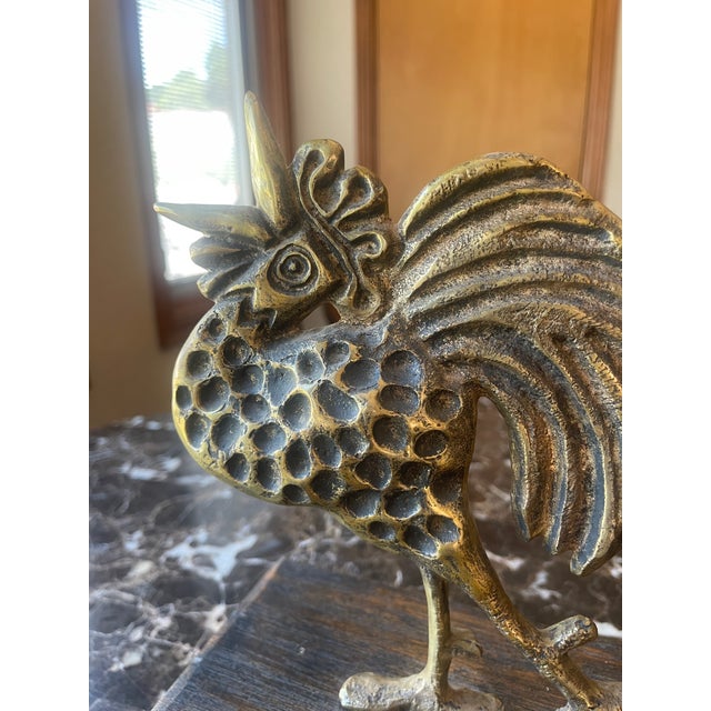 Contemporary Rooster Sculpture in Brass. The bottom of the wood base has worn fabric.