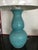 Lovely shade of turquoise/aqua dimpled ceramic lamp with white linen shade. Ceramic matching finial. 31” to top of finial....