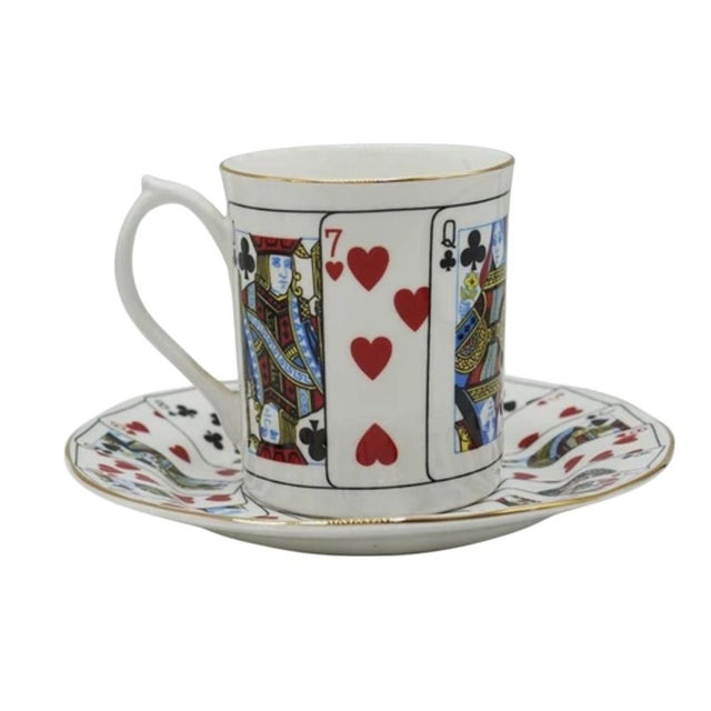 This rare and collectible set of 10 porcelain coffee cans with matching saucers was designed by Tiffany & Co. and features...