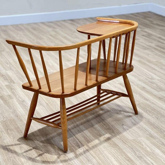 A quiet companion from a more gracious age, this Ercol telephone seat , designed by Lucian Ercolani and made in England in...
