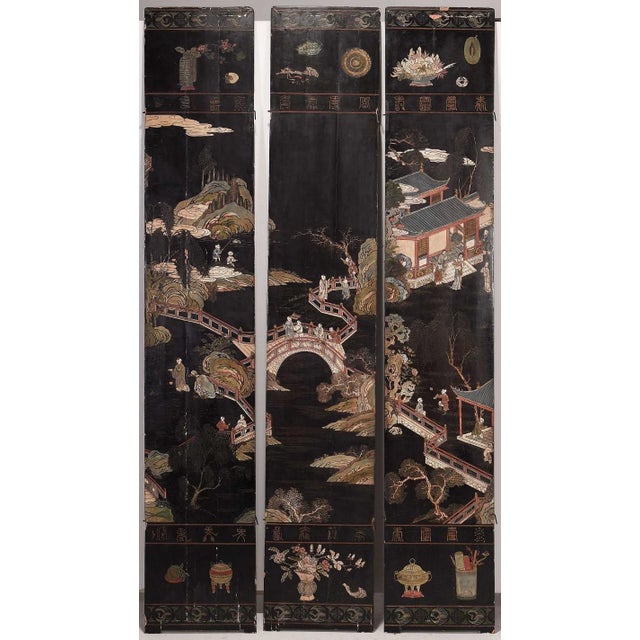 intricately carved and painted imagery of a Chinese lord surrounded by 100 boys at play in a landscape scene spanning 12...