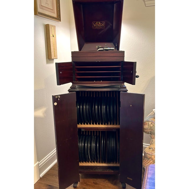 Victor Victrola with 135 vintage early 1900’s 78 rpm records including some rare finds in a broad genre from classical,...