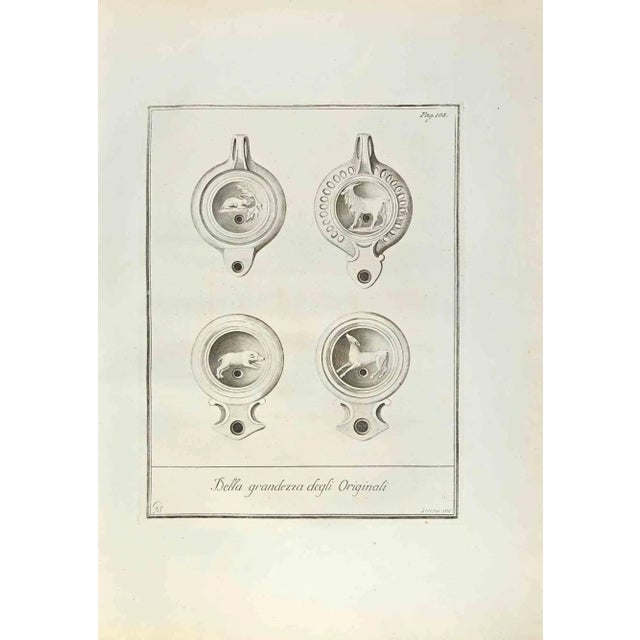 Pompeian Style Oil Lamps with Animals from "Antiquities of Herculaneum" is an etching on paper realized by Fernando Strina...