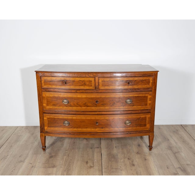 This exquisite 19th-century Neapolitan chest of drawers is a masterful example of Italian decorative cabinetry,...