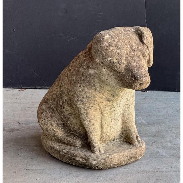 A handsome English garden stone pig or hog, modeled on its haunches, on raised oval base. A fine ornamental garden feature...