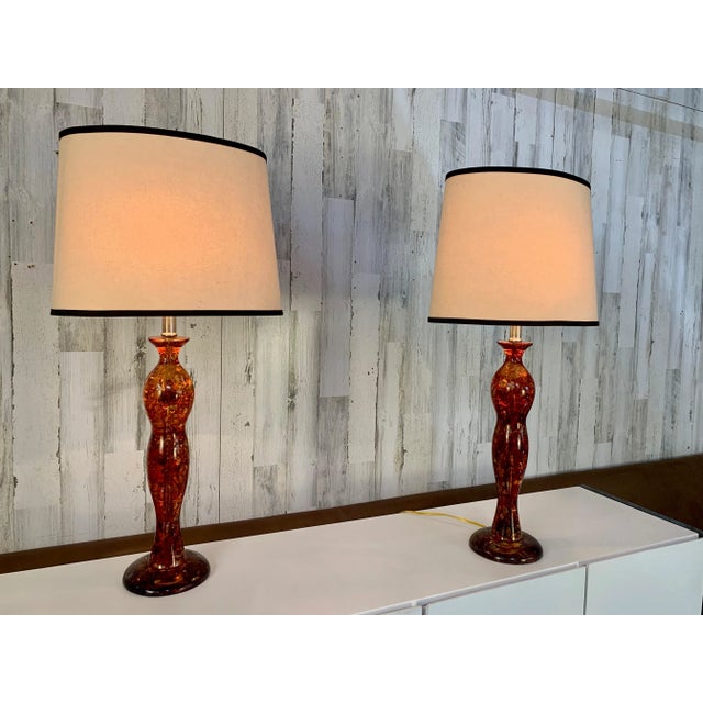 Pair of sculpted amber Resin table lamps, very free flow design with original oval lampshades. Made by Anthony California...