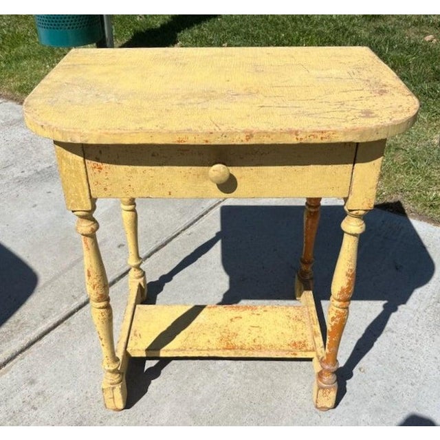 19thc mustard side table/end table from New England with single drawer. alligator-ed mustard paint. Wonderful design.