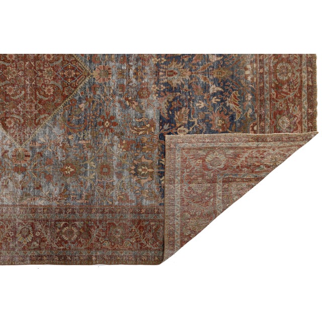 Imbued with timeless elegance and coveted vintage character, this authentic 19th-century antique Mahal rug brings a...