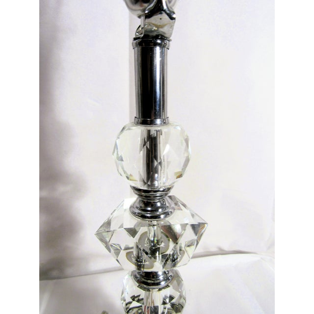 This is an elegant, beautiful heavy cut crystal glass lamp that stands, with harp, 22". The hardware is chrome silver. It...