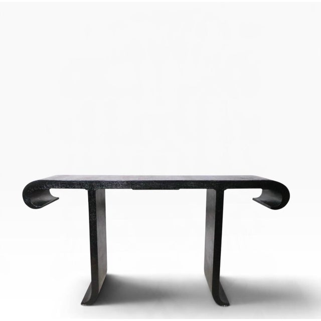 Voguish Hollywood Regency style, alter table, console table with a graphic black finish grass cloth surface. Very fine,...