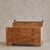 An Italian jewelry chest in honeyed burlwood, crafted in the 1960s. The rectangular form features three smooth-gliding...