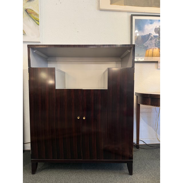 Design Plus Gallery presents a Craftsman Bar Cabinet by Councill. The cabinet is art deco inspired that blends in with a...