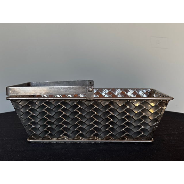 A petite metal basket with intricate silver lattice design. Perfectly festive year-round.