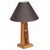 Mid-Century table lamp with hand-carved African figural accents, circa 1950.
